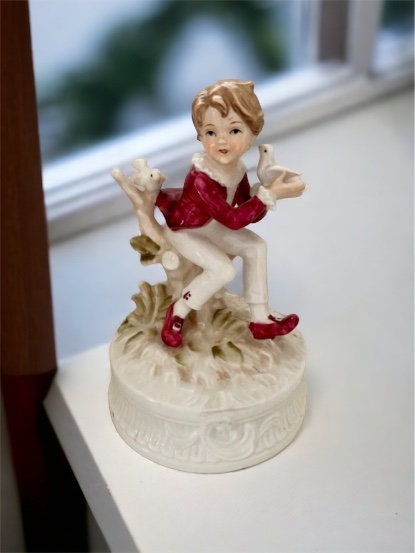 1977 Berman and Anderson stunning porcelain music box - boy dressed in red and white feeding birds