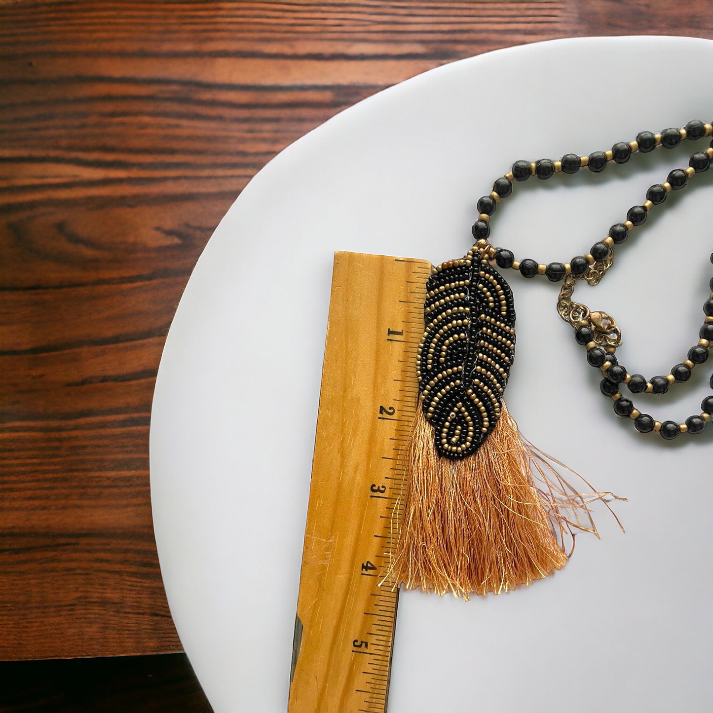 Stunning and unique hand beaded vintage artisan black and gold tassel necklace