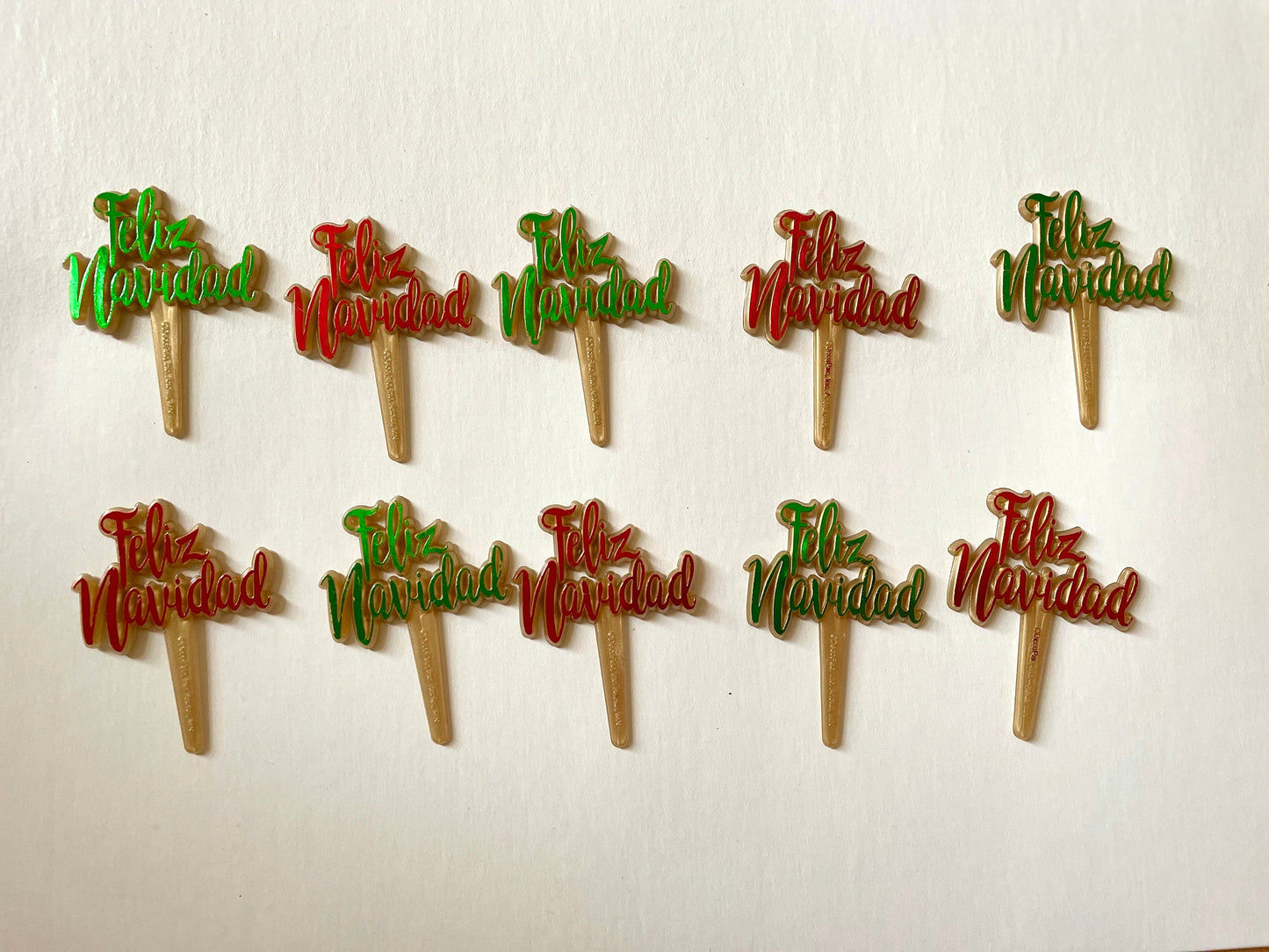 Pair of red and/or green iridescent plastic cake toppers - Feliz Navidad