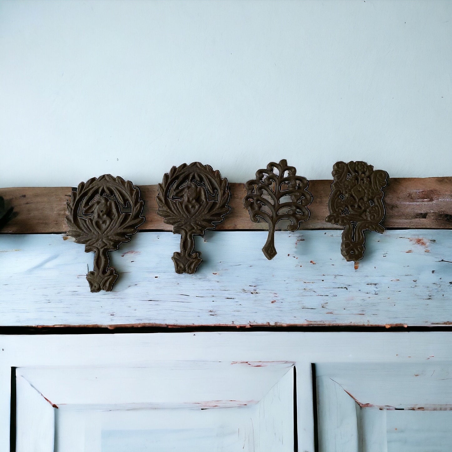Set of 4 small cast iron trivets - vintage or antique?