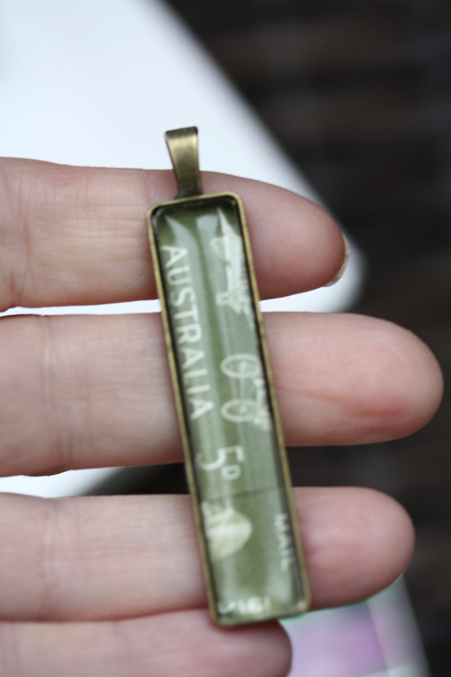 Necklace pendants made from genuine vintage and antique postage stamps from around the world - saints, Australian plane, Wicca  sun and moon