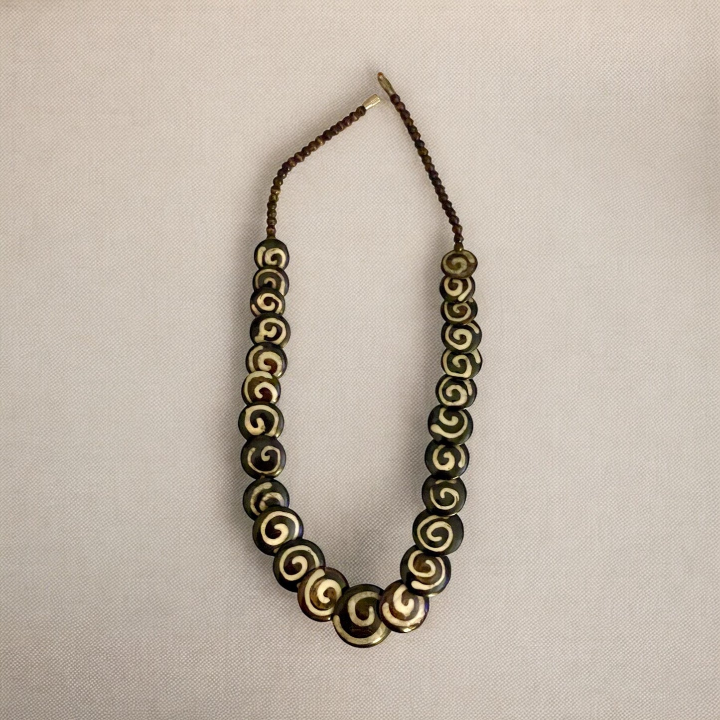 Tribal style vintage necklace - with beautiful swirled discs that are either bovine or wood?