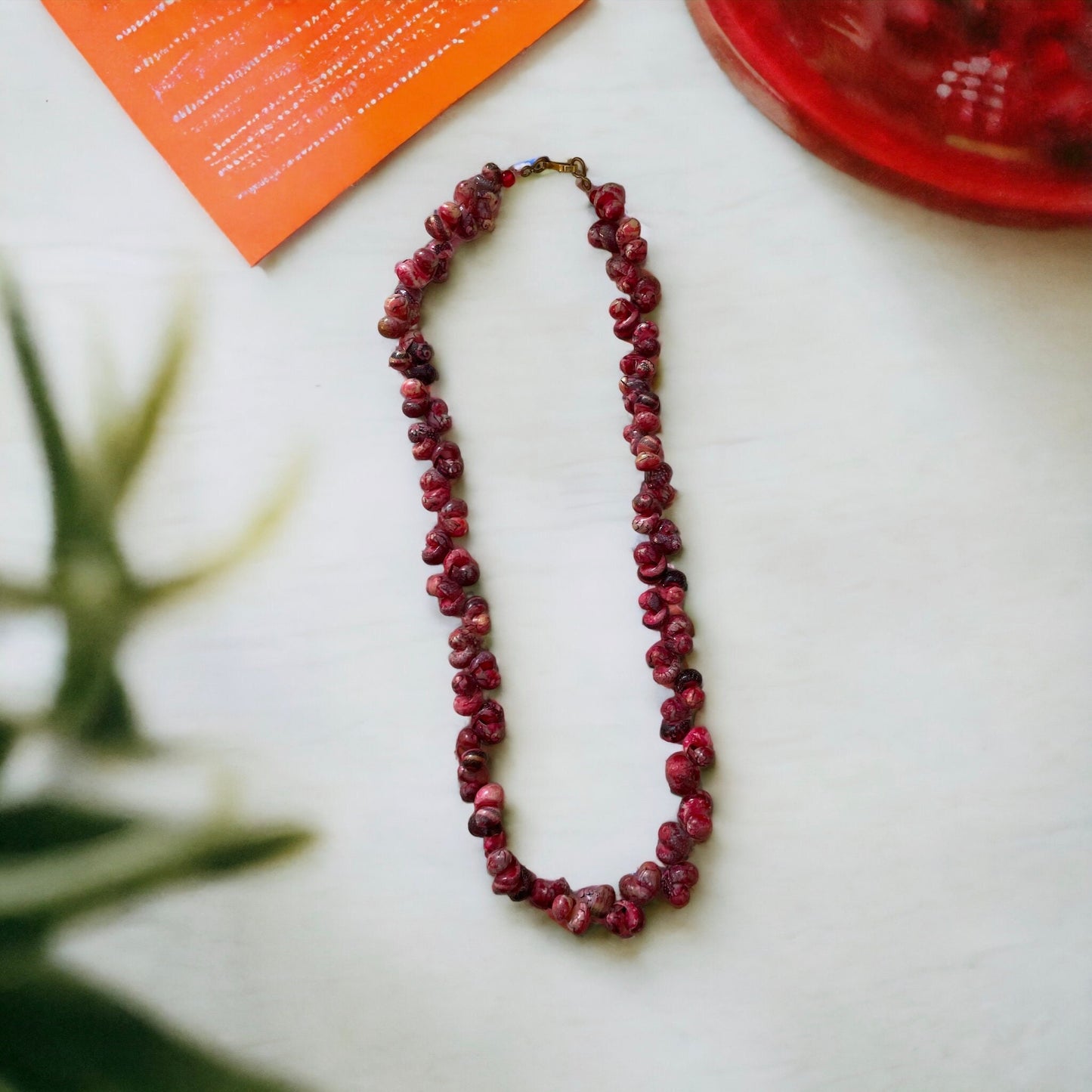 Unique vintage artisan shell necklace - shades of reddish pinks