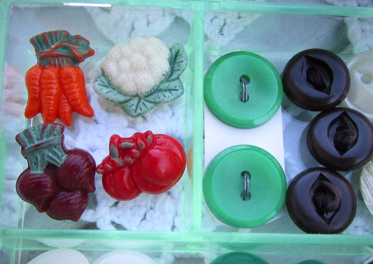 Vintage sewing inspiration box - filled with vintage buttons and sewing supplies shown - vegetable theme - in the shades of red and green