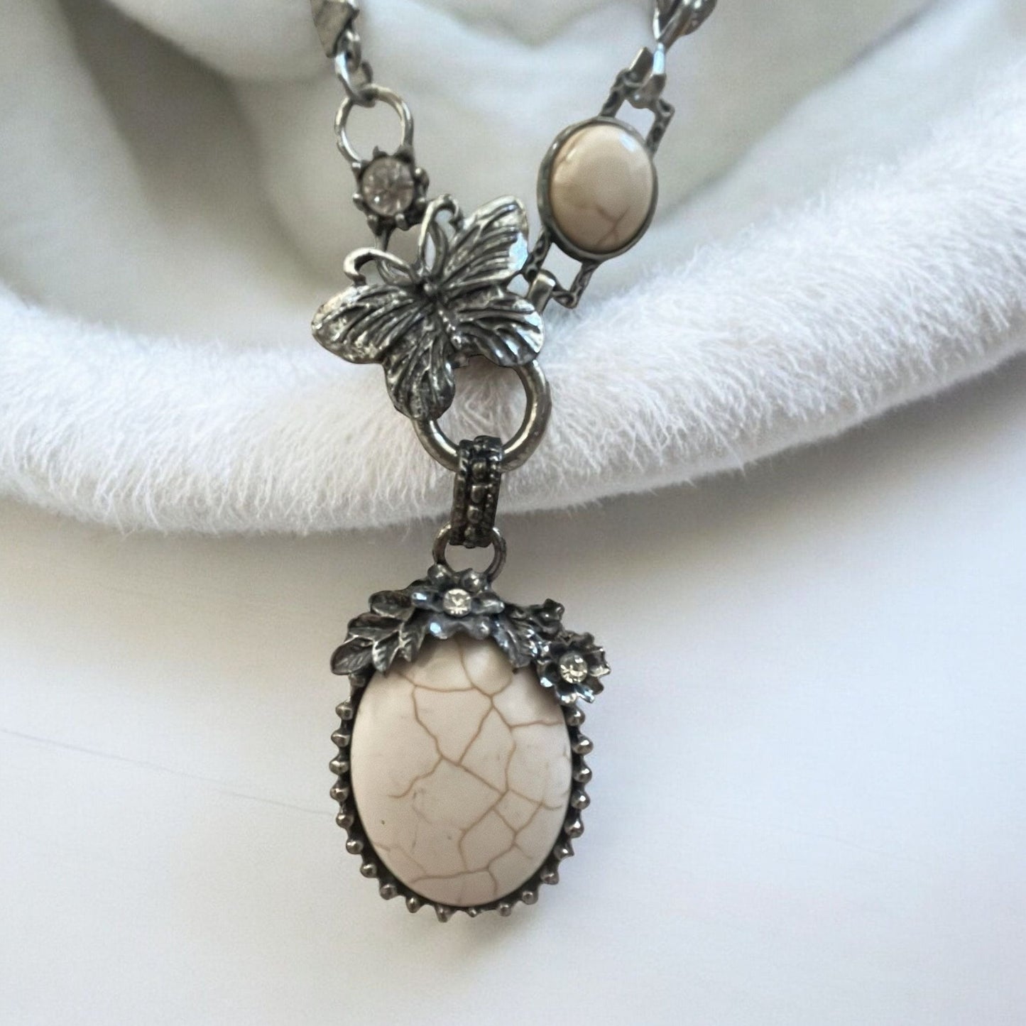 Stunning vintage white faux stone necklace with silver flowers and butterfly