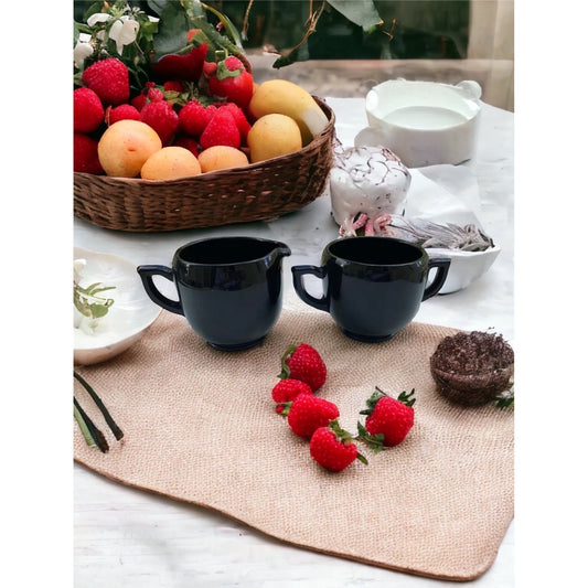 Vintage black glass cream and sugar set