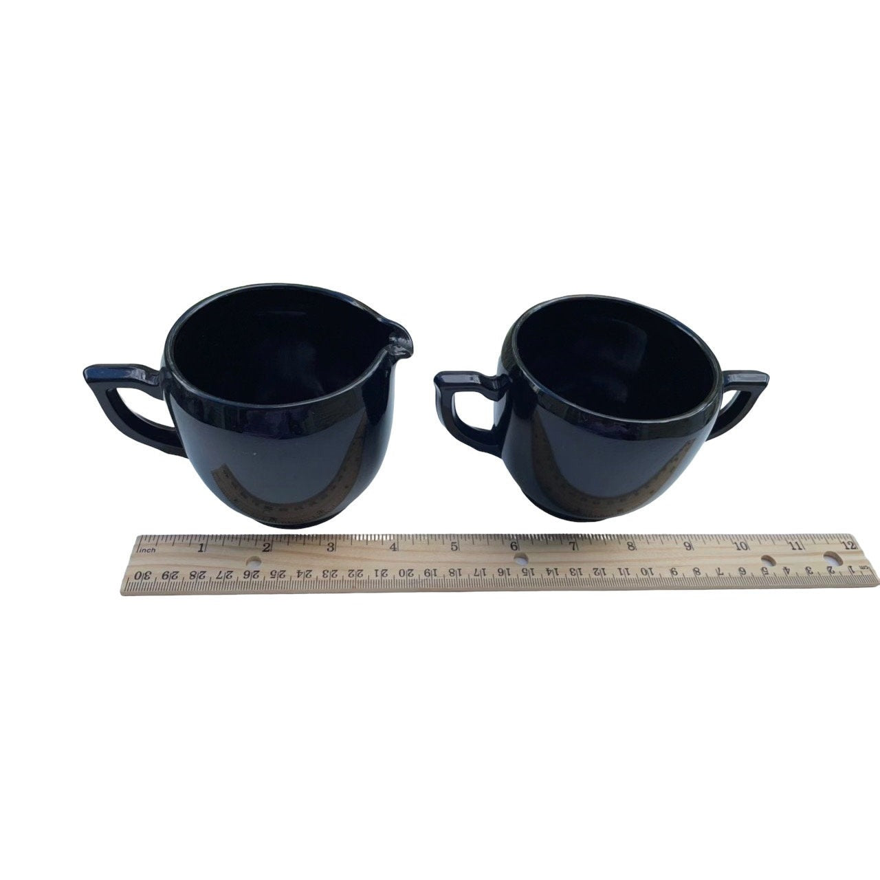 Vintage black glass cream and sugar set