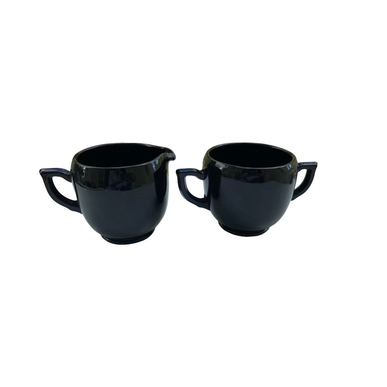 Vintage black glass cream and sugar set